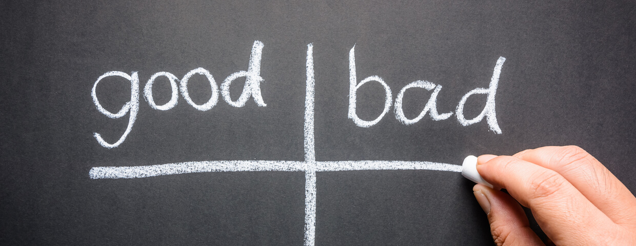 Hand writing good and bad sorting table with chalk on chalk board 