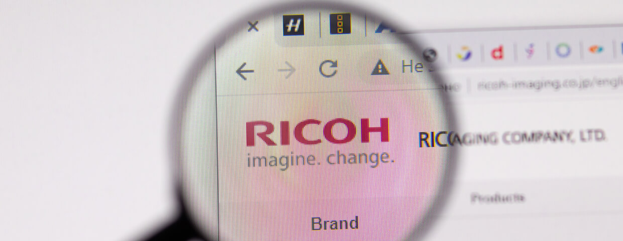 Magnifying glass hovering over Ricoh wesbite