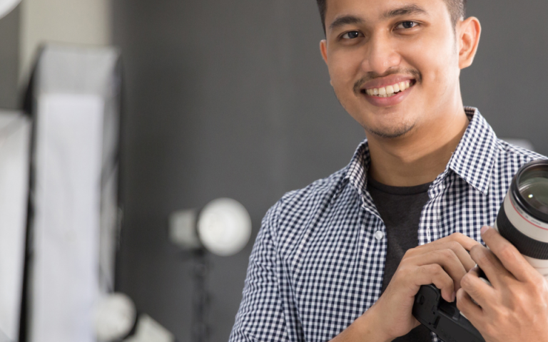 photographer holding camera